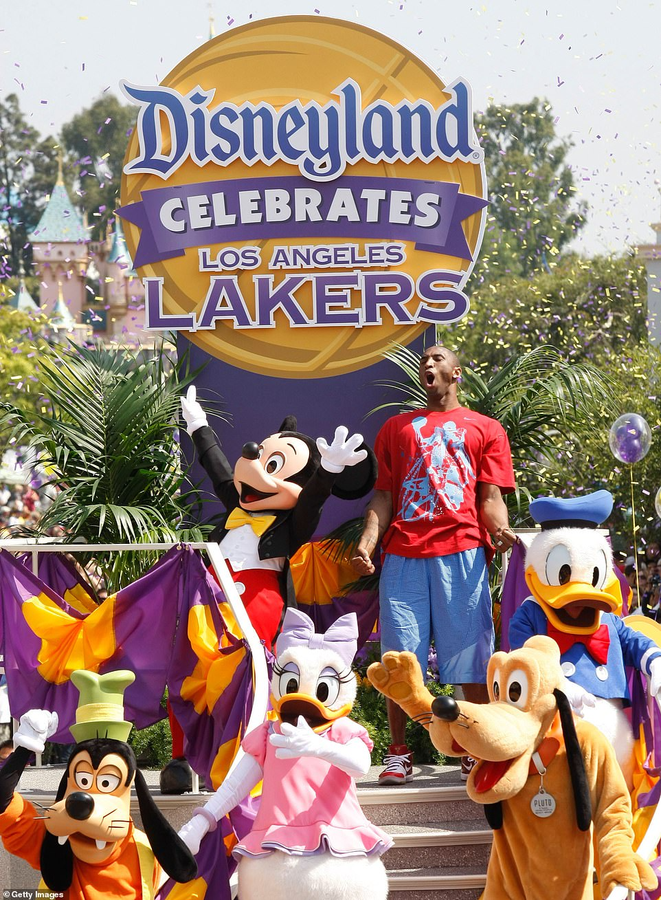 Kobe Bryant's magical family moment: Celebrating the Lakers' NBA championship victory at Disneyland with his wife Vanessa and daughters Natalia and Gianna in 2010